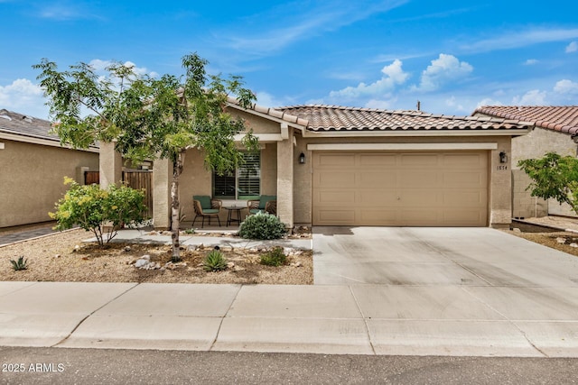 1874 E Mesquite Ave, Apache Junction, AZ 85119 - view of front facade with stucco siding, an attached garage, concrete driveway, and a tile roof