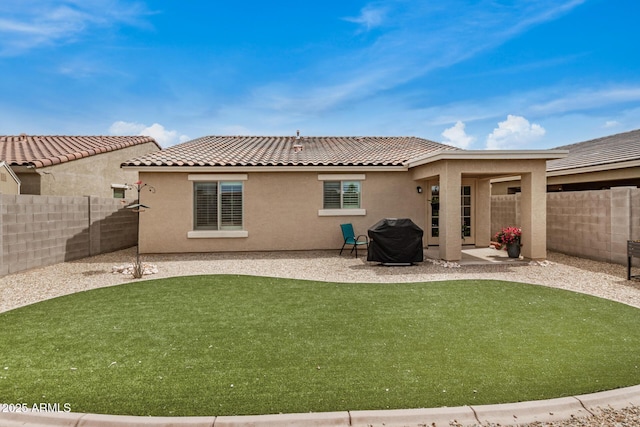1874 E Mesquite Ave, Apache Junction, AZ 85119 - rear view of property with stucco siding, a tile roof, and a patio