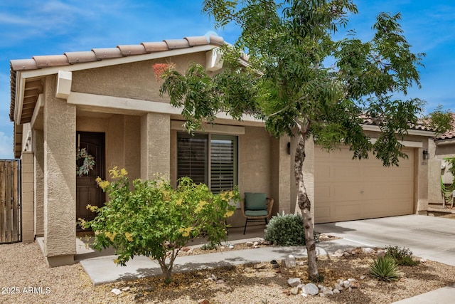 1874 E Mesquite Ave, Apache Junction, AZ 85119 - view of front of house with a garage, stucco siding, and driveway
