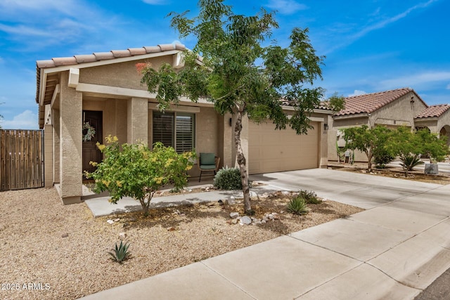 1874 E Mesquite Ave, Apache Junction, AZ 85119 - view of front of home featuring stucco siding, an attached garage, driveway, and a tile roof