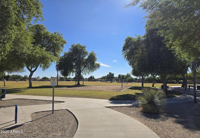 view of home's community with a yard and volleyball court