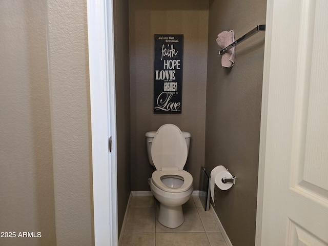 bathroom with tile patterned flooring and toilet