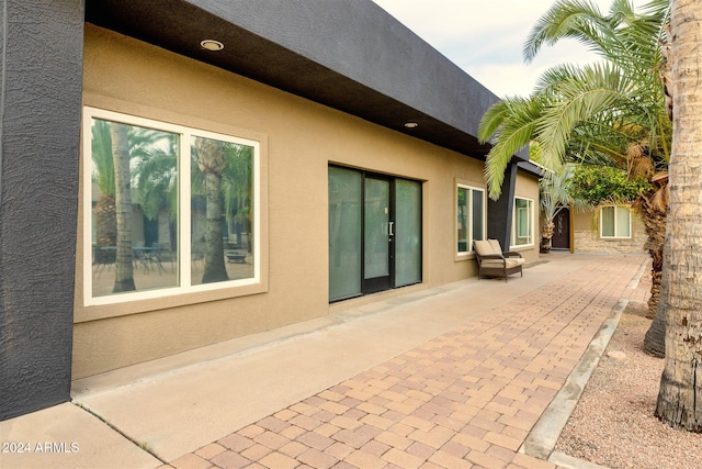 back of property featuring a patio area