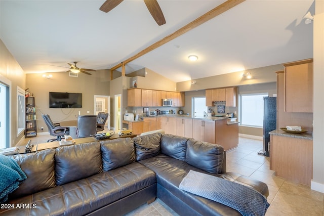 tiled living room with vaulted ceiling with beams and ceiling fan