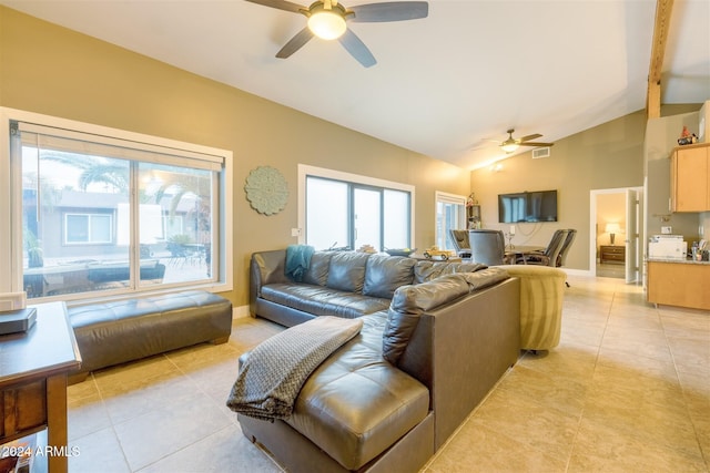 tiled living room featuring ceiling fan and lofted ceiling with beams