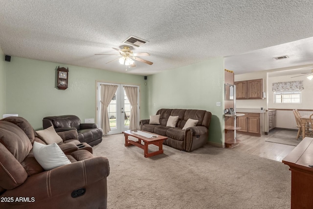 2003 W Tyson St, Chandler, AZ 85224 - living room with visible vents, ceiling fan, light carpet, and french doors
