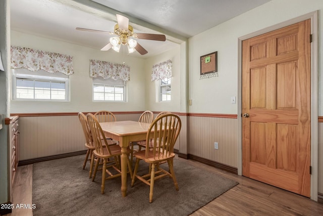 2003 W Tyson St, Chandler, AZ 85224 - dining space featuring wood finished floors, ceiling fan, and a wainscoted wall