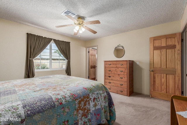 2003 W Tyson St, Chandler, AZ 85224 - bedroom featuring ceiling fan, visible vents, a textured ceiling, and light colored carpet