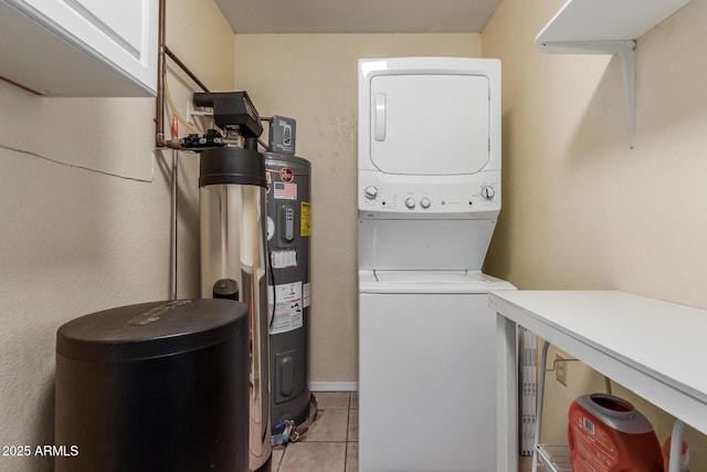 2003 W Tyson St, Chandler, AZ 85224 - laundry area with cabinet space, light tile patterned flooring, and stacked washer and clothes dryer