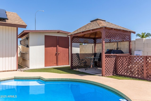 2003 W Tyson St, Chandler, AZ 85224 - view of pool with fence, a storage unit, a gazebo, a fenced in pool, and an outbuilding