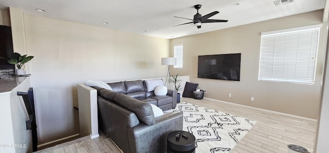 4705 E Red Oak Ln Unit 101, Gilbert, AZ 85297 - living area with a ceiling fan, wood finished floors, and recessed lighting