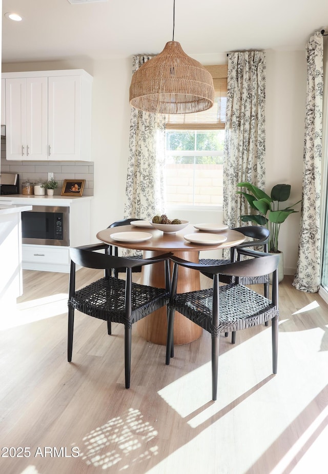 dining room featuring light hardwood / wood-style floors