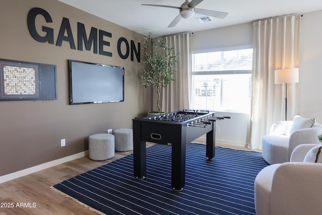 game room featuring hardwood / wood-style floors and ceiling fan