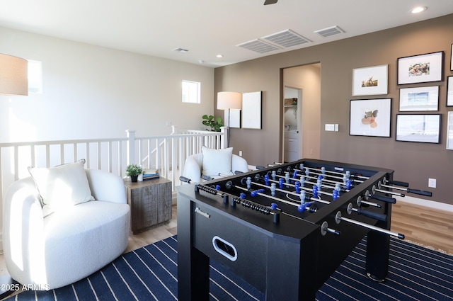 recreation room with hardwood / wood-style flooring