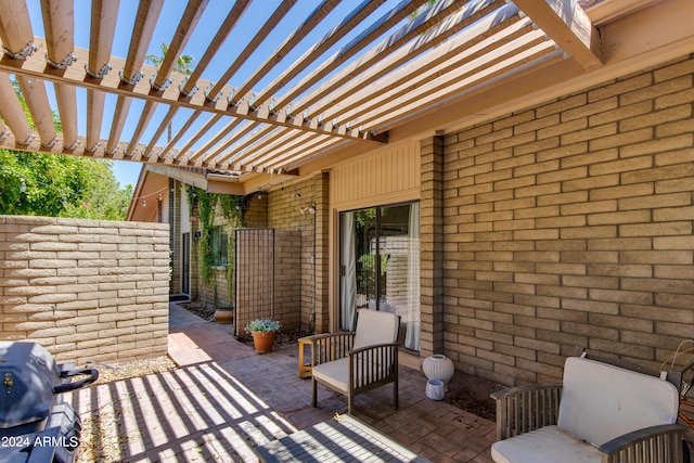 view of patio with a pergola and a grill