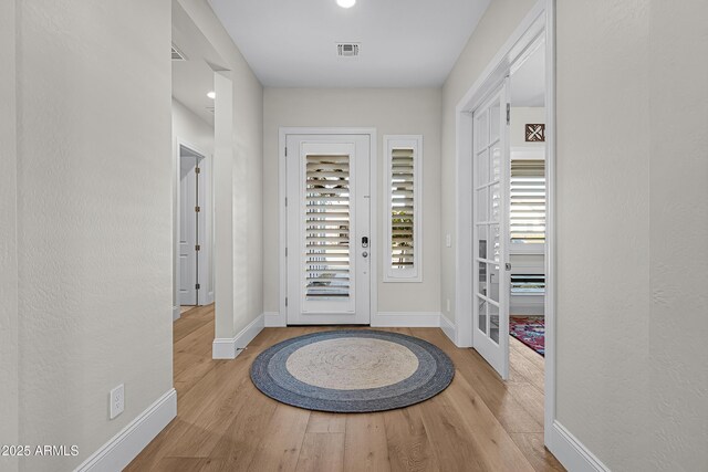 1439 E Mead Dr, Gilbert, AZ 85298 - foyer with wood finished floors, baseboards, and french doors