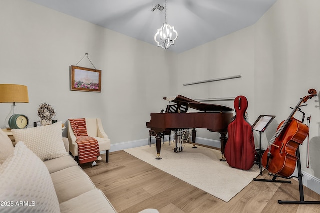 1439 E Mead Dr, Gilbert, AZ 85298 - living area with wood finished floors, baseboards, and a chandelier