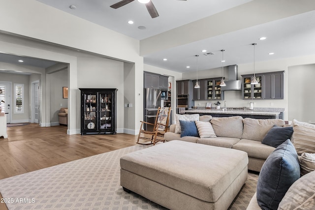 1439 E Mead Dr, Gilbert, AZ 85298 - living room with wood finished floors, ceiling fan, recessed lighting, and baseboards