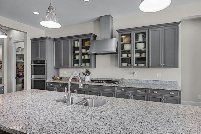 1439 E Mead Dr, Gilbert, AZ 85298 - kitchen with wall chimney exhaust hood, a sink, stainless steel appliances, decorative light fixtures, and light stone countertops