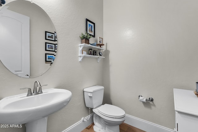 1439 E Mead Dr, Gilbert, AZ 85298 - bathroom featuring wood finished floors, a sink, baseboards, and toilet