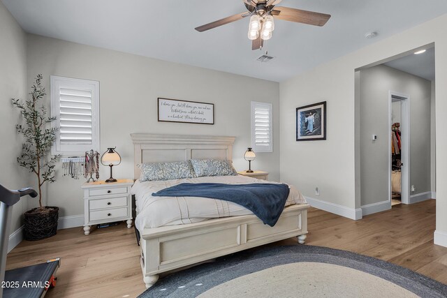 1439 E Mead Dr, Gilbert, AZ 85298 - bedroom with wood finished floors, baseboards, and ceiling fan