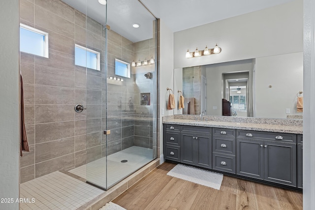 1439 E Mead Dr, Gilbert, AZ 85298 - bathroom with a shower stall, wood finished floors, and vanity