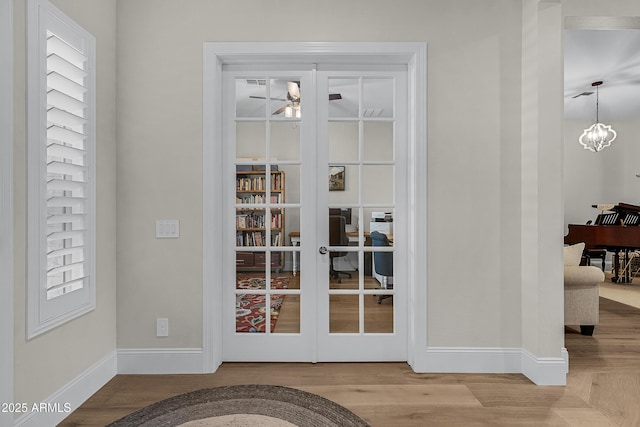 1439 E Mead Dr, Gilbert, AZ 85298 - doorway to outside featuring baseboards, wood finished floors, and french doors