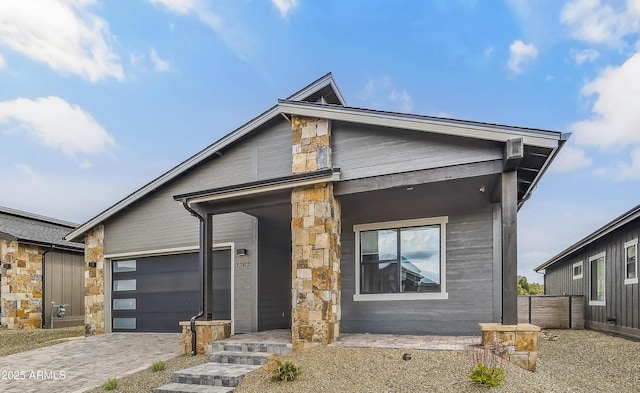 3367 W Lyra Way, Flagstaff, AZ 86001 - view of front of home with an attached garage, driveway, and stone siding