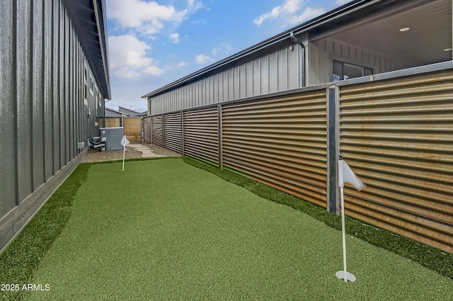 3367 W Lyra Way, Flagstaff, AZ 86001 - view of yard with a putting green and central AC unit