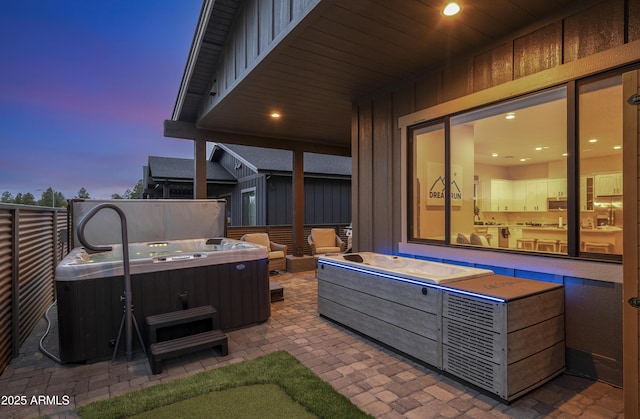 3367 W Lyra Way, Flagstaff, AZ 86001 - patio terrace at dusk with a hot tub and a patio