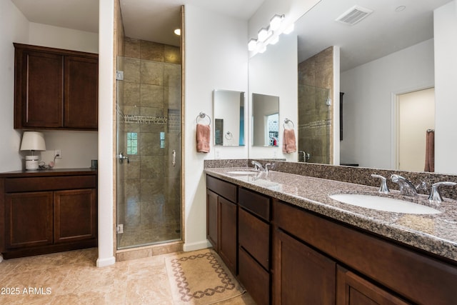 bathroom with vanity, tile patterned floors, and walk in shower