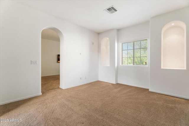 unfurnished room featuring carpet