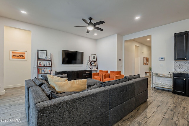 living area featuring recessed lighting, ceiling fan, and wood finished floors