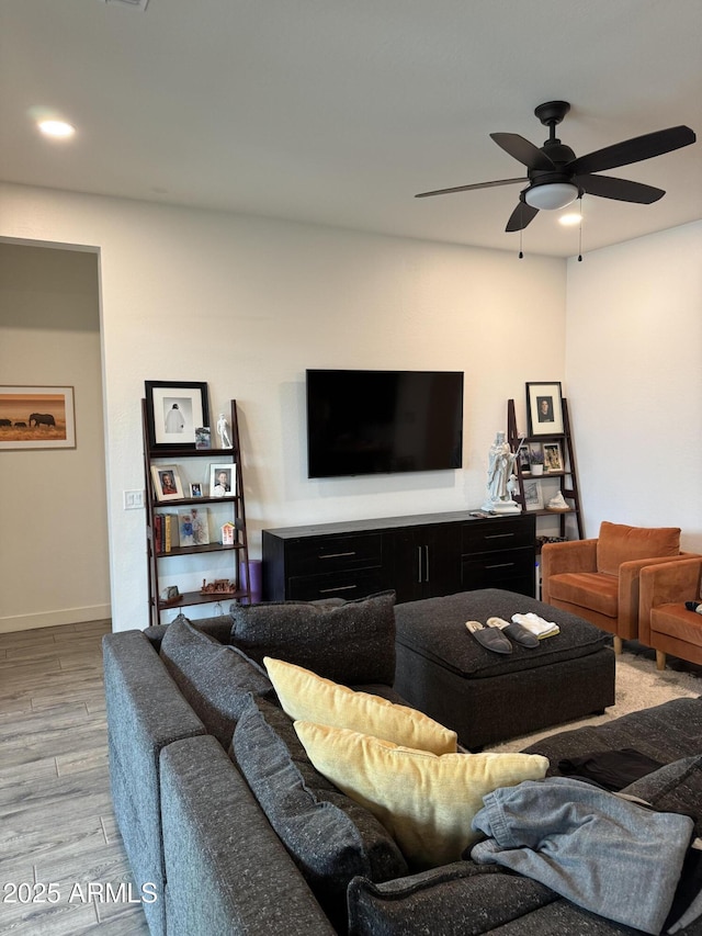 living area featuring recessed lighting, baseboards, ceiling fan, and wood finished floors