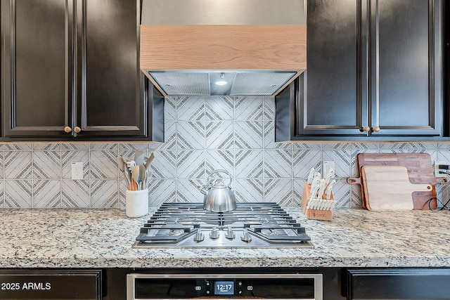 kitchen featuring tasteful backsplash, wall oven, and stainless steel gas cooktop