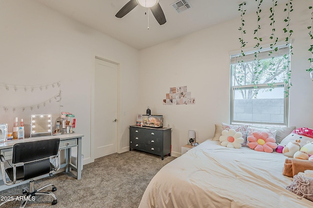 bedroom with visible vents, carpet floors, baseboards, and ceiling fan