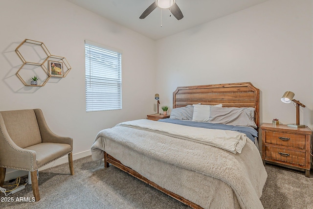 carpeted bedroom featuring a ceiling fan and baseboards