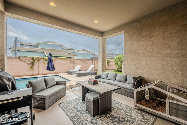 view of patio featuring a fenced backyard and outdoor lounge area