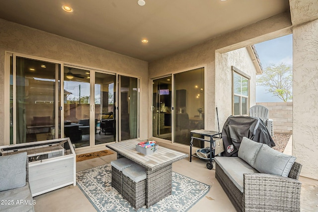 view of patio with an outdoor hangout area and fence