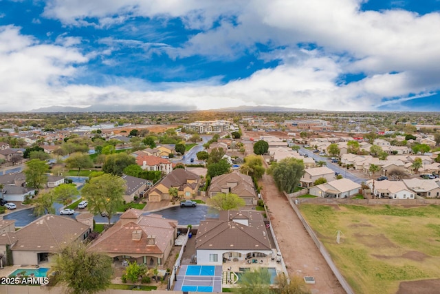 birds eye view of property with a residential view