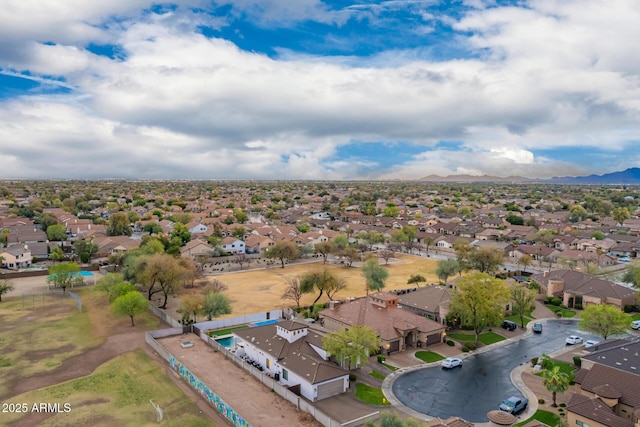 birds eye view of property featuring a mountain view and a residential view