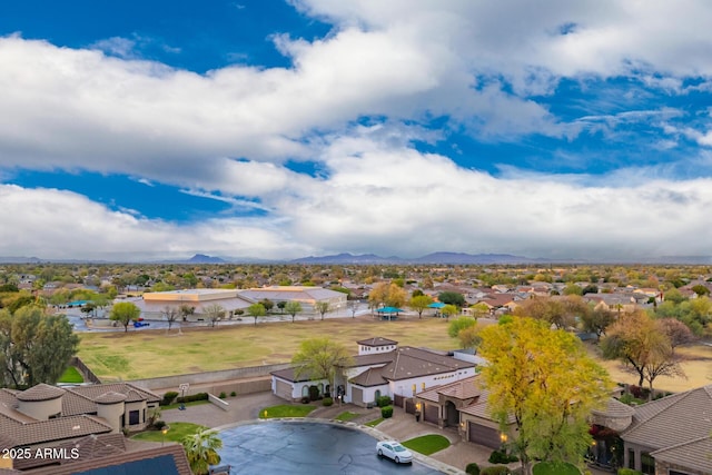 drone / aerial view featuring a mountain view and a residential view