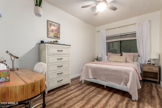 bedroom with ceiling fan, visible vents, baseboards, and dark wood-style floors