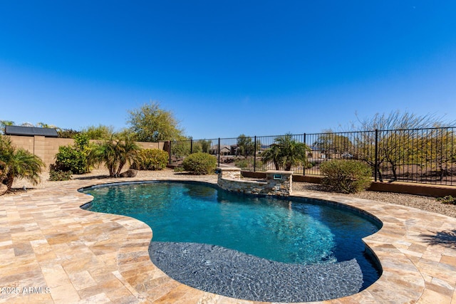 view of pool with a patio area, a fenced backyard, and a fenced in pool