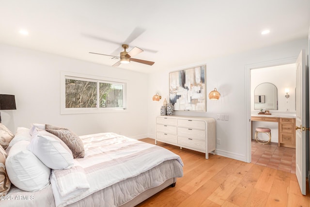 16227 N 63rd Pl, Scottsdale, AZ 85254 - bedroom featuring light wood-style flooring, baseboards, recessed lighting, ceiling fan, and connected bathroom