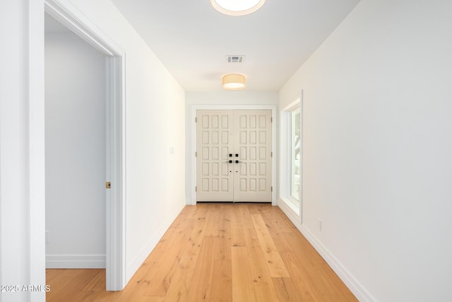 16227 N 63rd Pl, Scottsdale, AZ 85254 - doorway to outside featuring light wood finished floors and baseboards