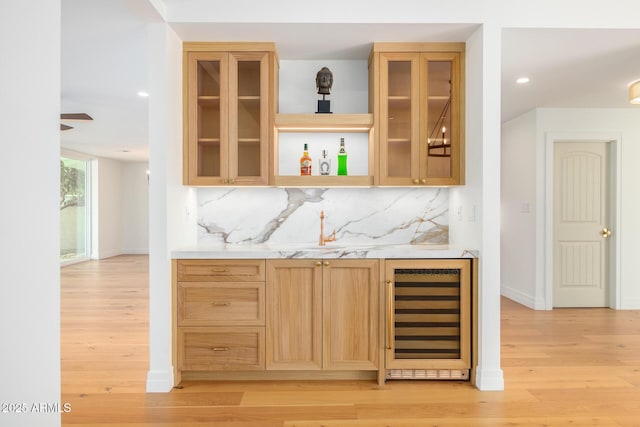 16227 N 63rd Pl, Scottsdale, AZ 85254 - indoor bar with wine cooler, light wood-type flooring, tasteful backsplash, and recessed lighting