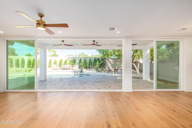 16227 N 63rd Pl, Scottsdale, AZ 85254 - doorway with healthy amount of natural light, ceiling fan, and wood finished floors