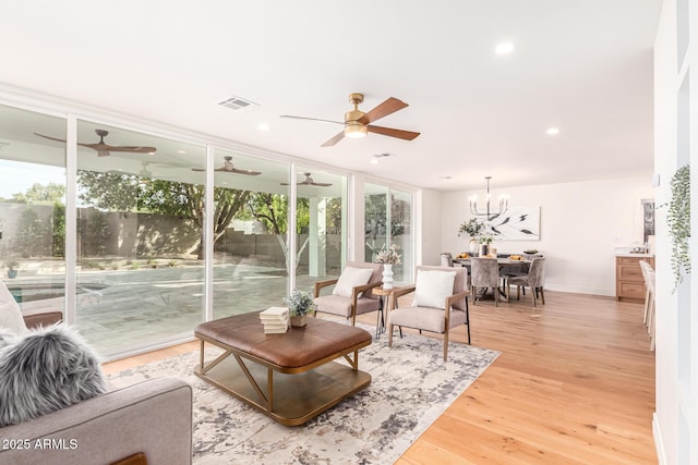 16227 N 63rd Pl, Scottsdale, AZ 85254 - living room with a ceiling fan, light wood-style floors, a chandelier, recessed lighting, and baseboards