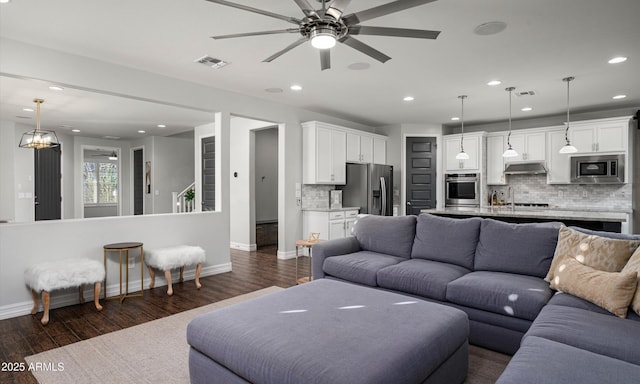 2915 W Night Owl Ln, Phoenix, AZ 85085 - living area featuring baseboards, recessed lighting, a ceiling fan, and dark wood-style flooring
